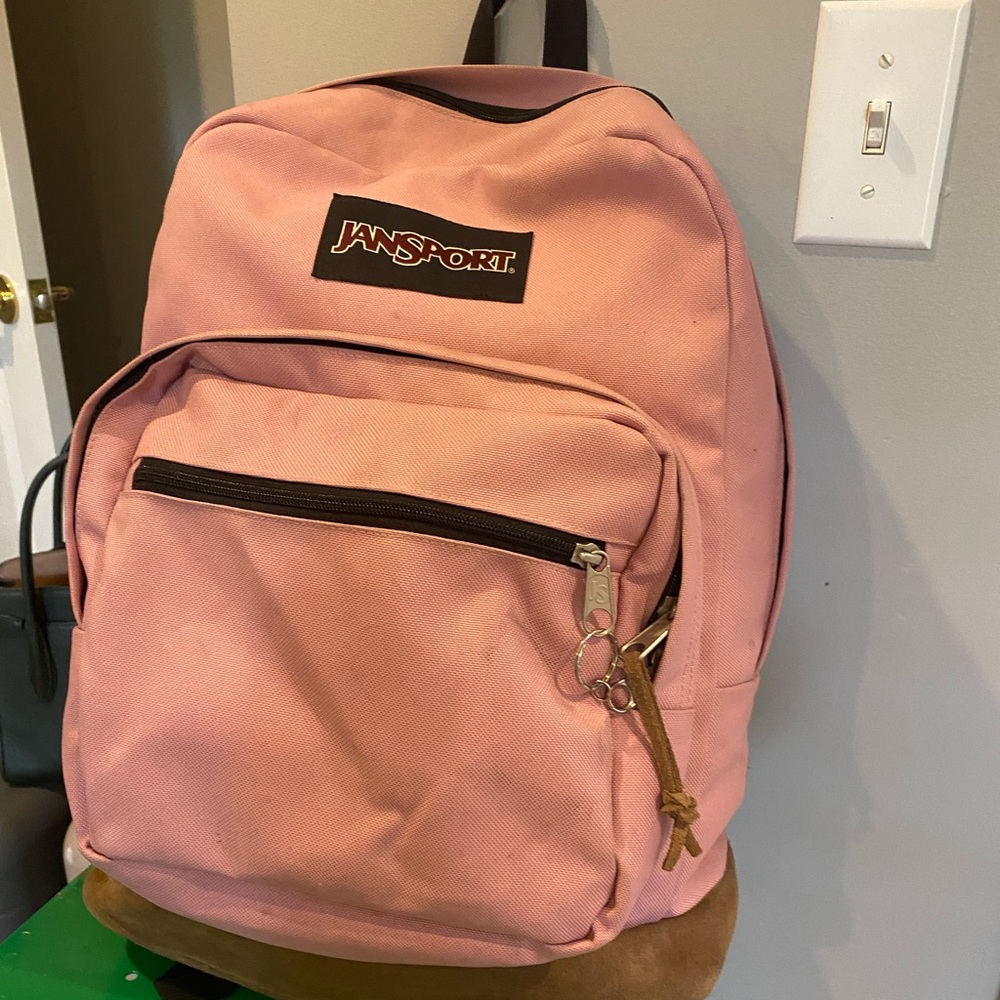 Pink jansport right-pack back pack.